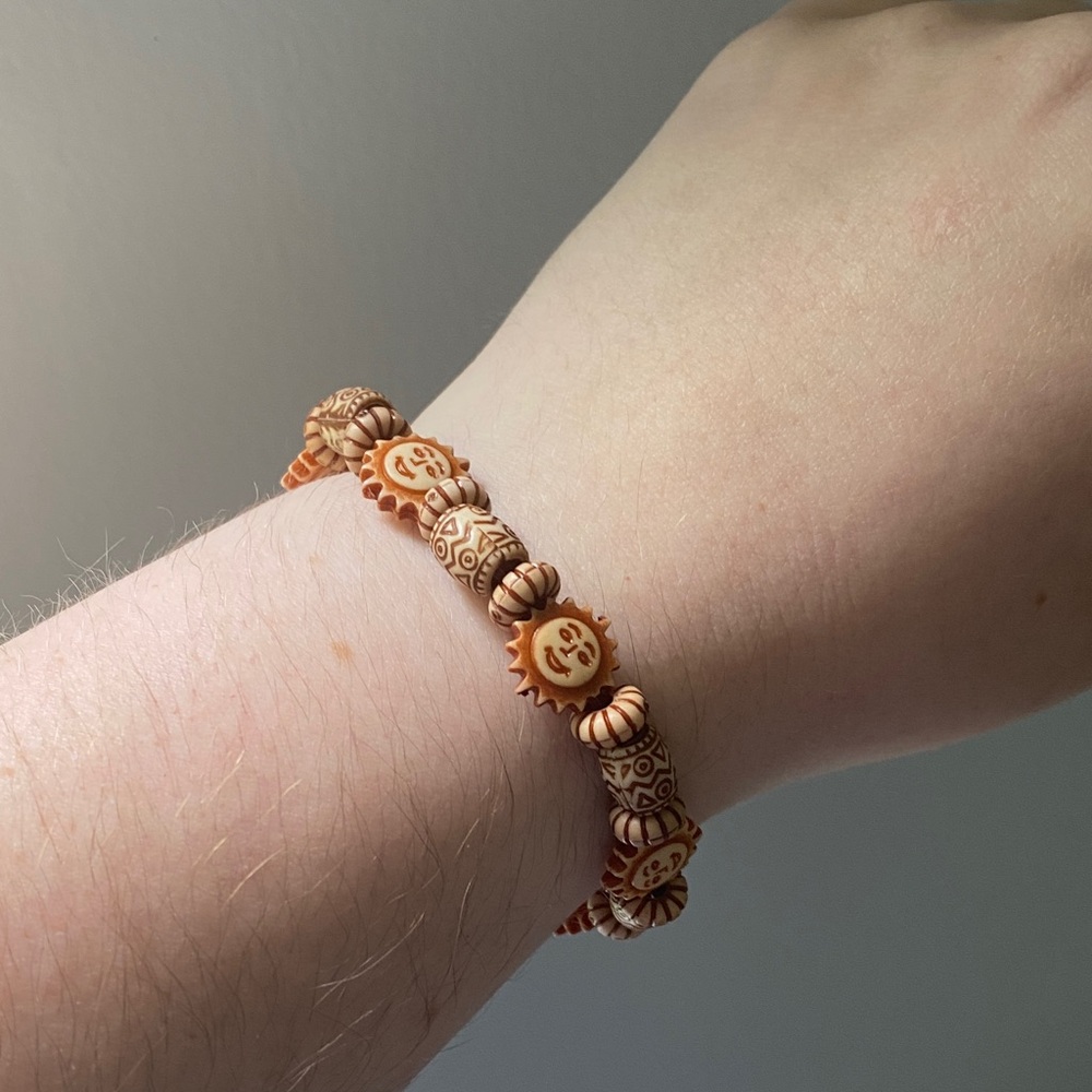 Wooden-style sun and barrel bead bracelet